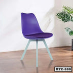 Modern purple metal tulip chair with cushioned seat on wooden floor, indoor plant nearby