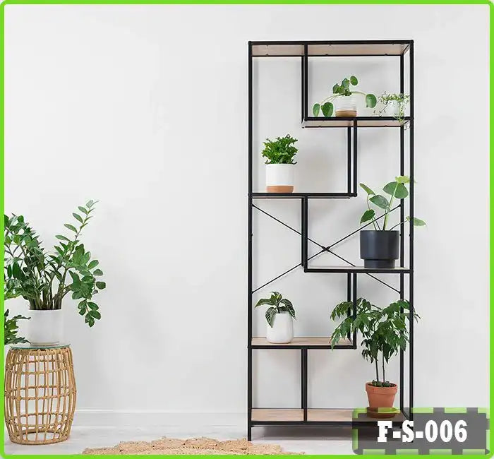Tall metal and wood plant stand with potted indoor plants against a white wall Main image