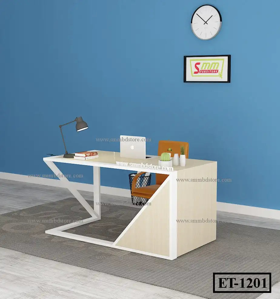 Modern office desk with metal frame, laptop, lamp, chair, and decor against blue wall