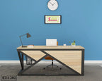 Modern wooden office desk with metal frame, laptop, lamp, and decor in a blue-walled workspace.