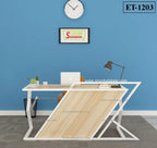 Modern office desk with lamp, laptop, plants, and abstract frame against blue wall