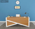 Modern wooden office desk with white accents, laptop, lamp, and decor against blue wall