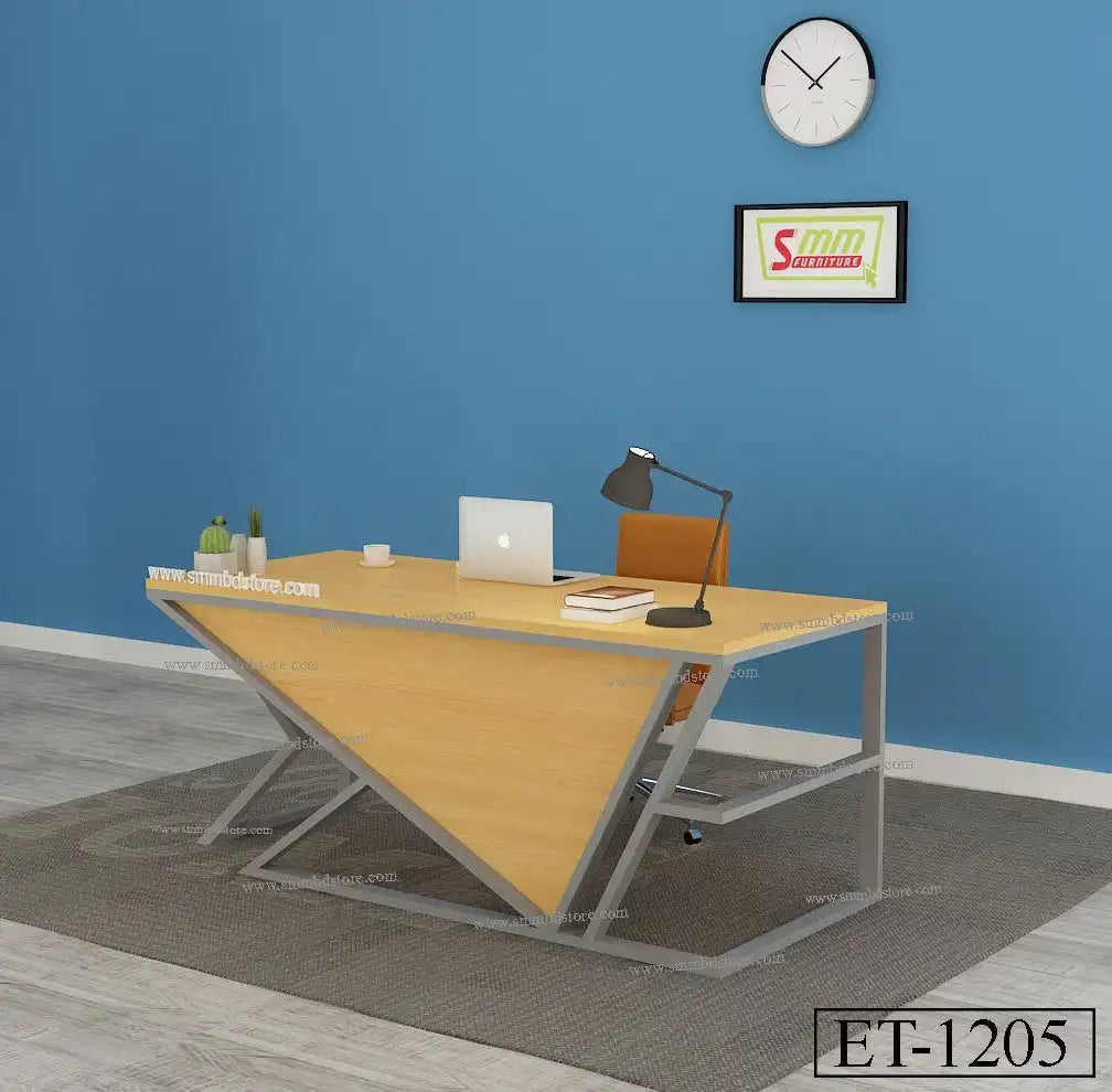 Modern office desk with triangular wood panel, lamp, laptop, chair and decor against blue wall