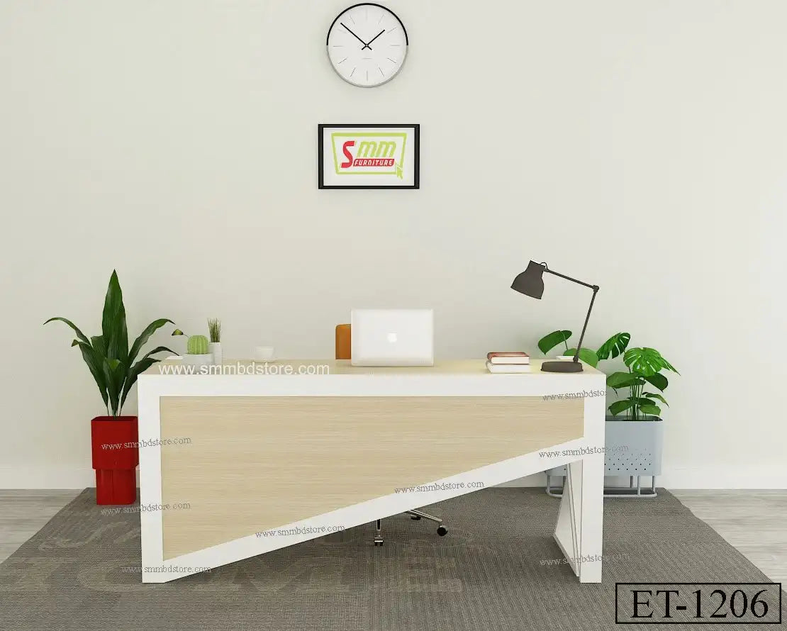 Modern office desk with laptop, lamp, books, and indoor plants in a minimalist workspace