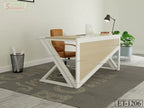 Modern office desk with light wood and white frame, brown chair, laptop, lamp, and potted plant