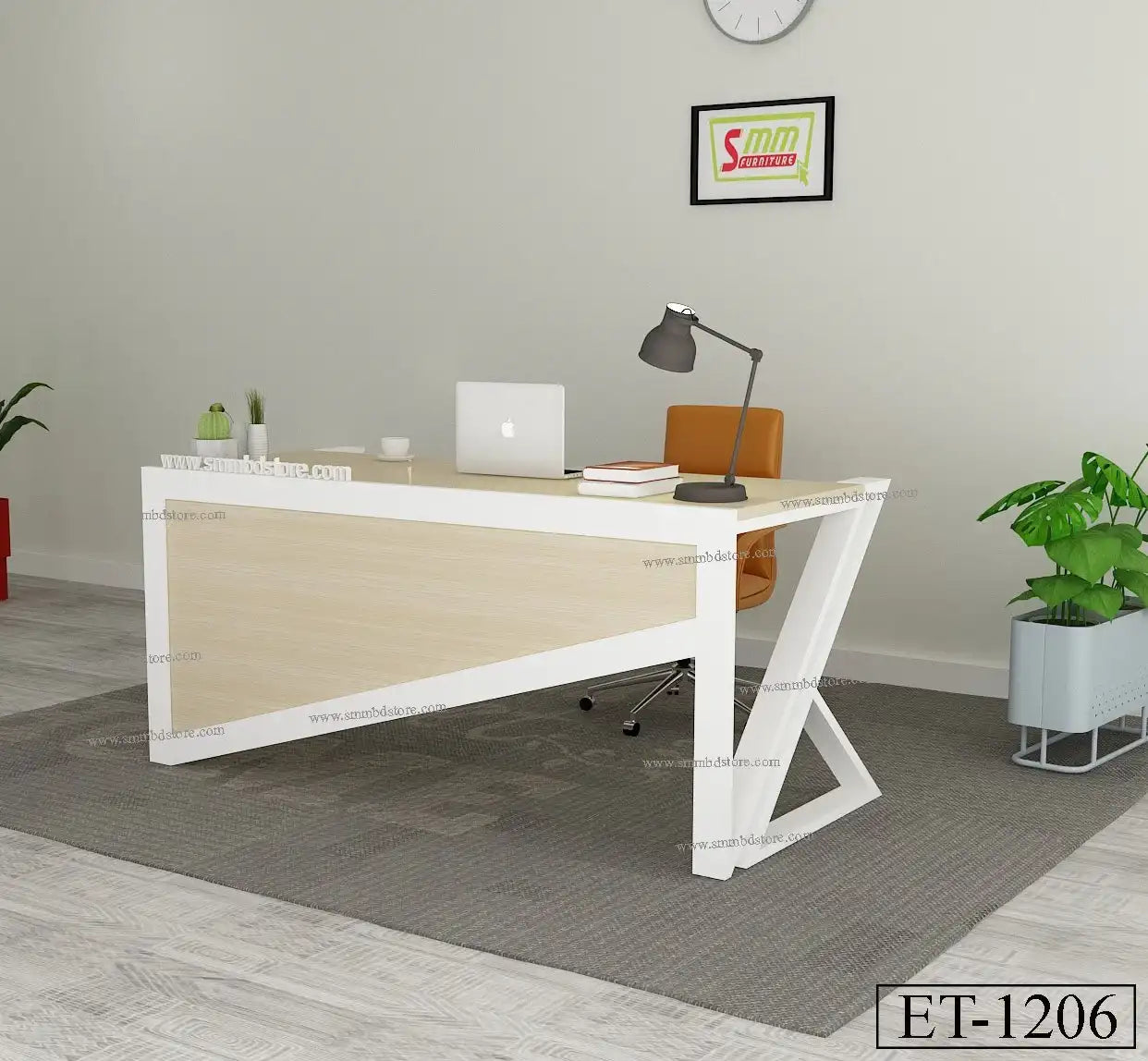 Modern office desk with a light wood finish, white frame, laptop, lamp, and indoor plant