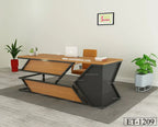 Modern office desk ET-1209 with wood finish, black metal frame, chair, and indoor plants