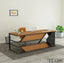 Modern executive office desk with black metal frame, wood surface, and brown chair