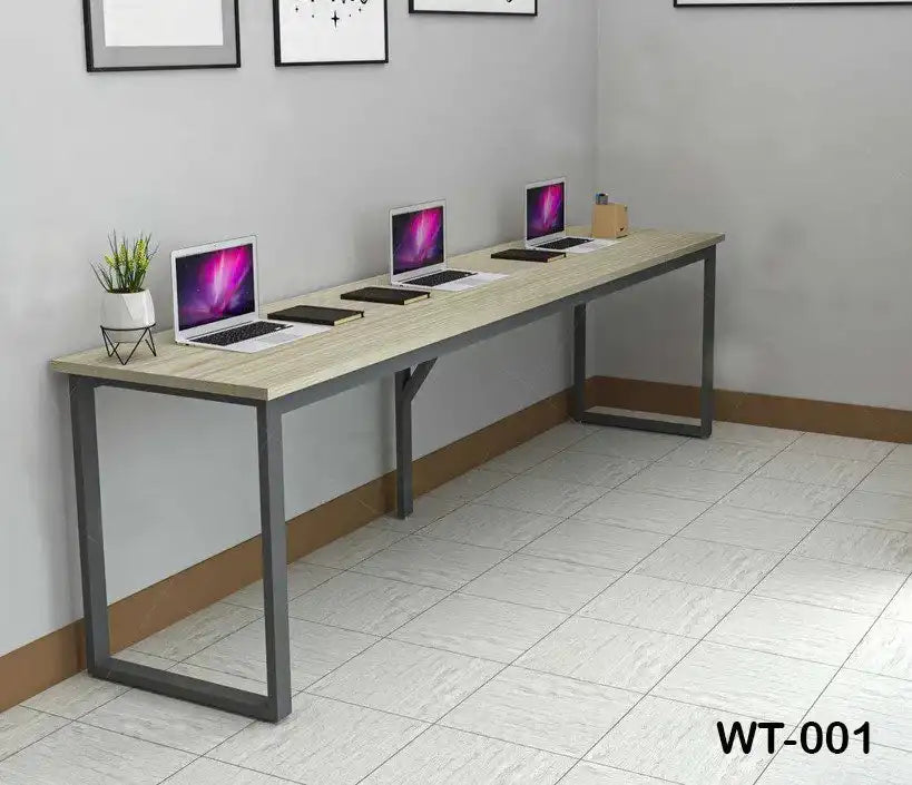 Modern office desk with metal frame, four laptops, notebooks, and minimalist decor in a workspace.