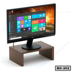 Wooden monitor stand holding a computer monitor, ideal for office desk organization.