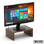Wooden monitor stand holding a computer monitor, ideal for office desk organization.