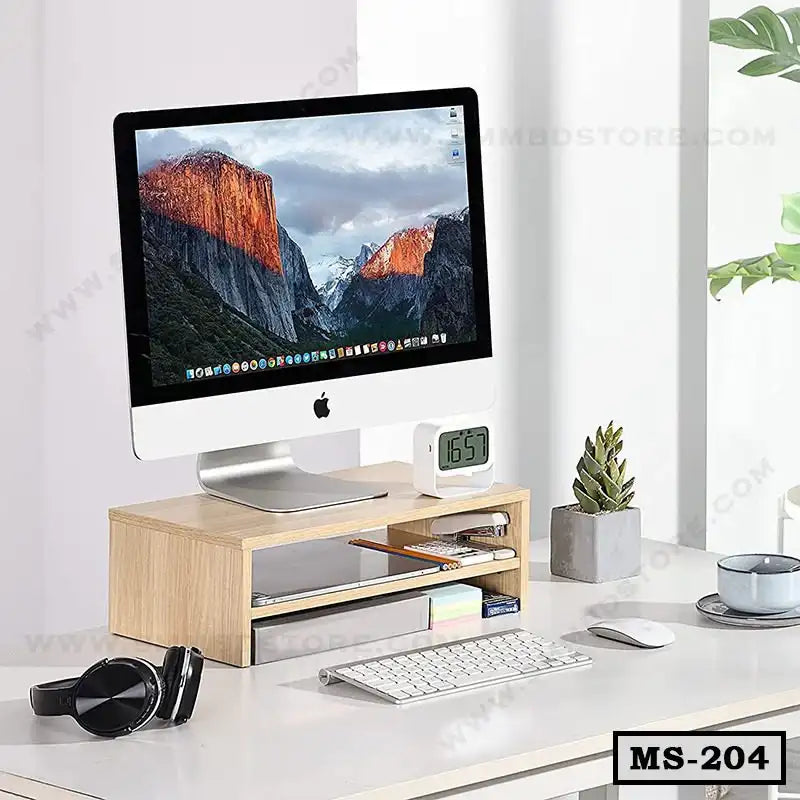 Wooden monitor stand organizer with iMac, keyboard, clock, and desk accessories on white table