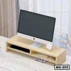 Wooden monitor stand with storage compartments holding an iMac on a modern desk