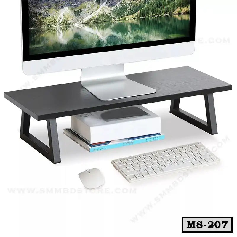 Modern black wooden monitor stand for desk organization with computer, books, keyboard, and mouse