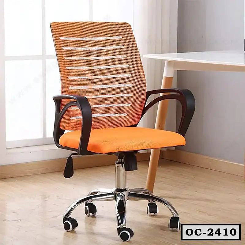 Orange ergonomic office chair with mesh back and wheels next to a modern white desk