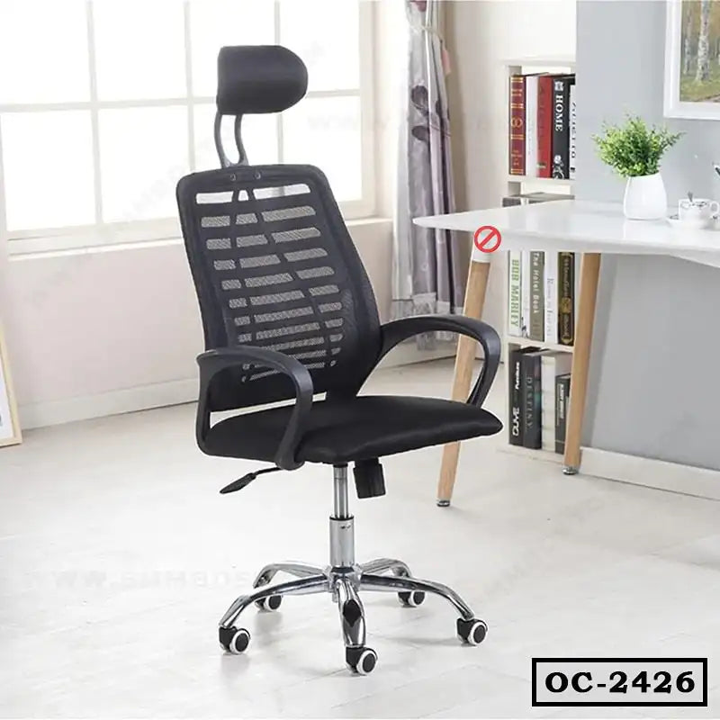 Ergonomic black mesh office chair with headrest and armrests in a modern home office setting