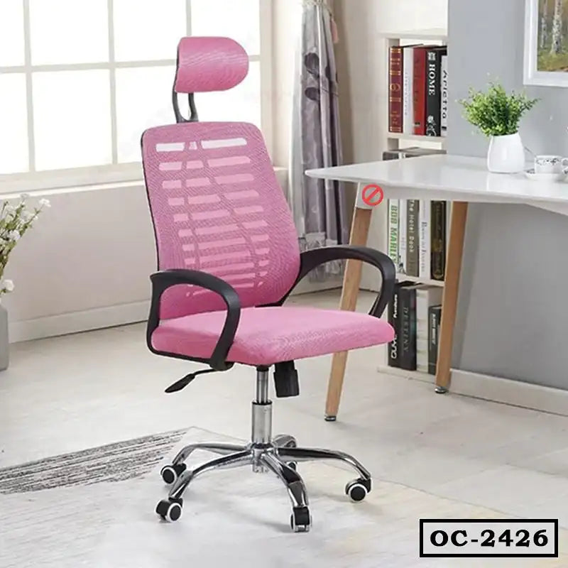 Modern pink ergonomic office chair with headrest and armrests in a home office setting