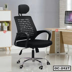 Black ergonomic office chair with mesh back and adjustable headrest in modern workspace