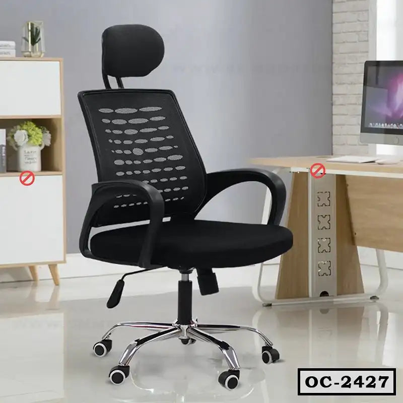 Black ergonomic office chair with mesh back and adjustable headrest in modern workspace