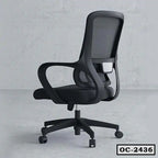 Black ergonomic mesh office chair with armrests and wheels on a grey floor