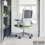Modern ergonomic office chair with green seat and mesh back in a bright workspace