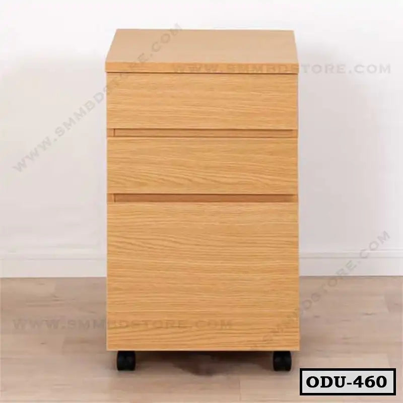 Modern wooden office drawer unit with three drawers and wheels on a light floor