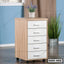 Modern wooden office drawer unit with five white drawers on wheels, indoor setting