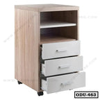 Wooden office drawer unit with three white drawers, open shelves, and caster wheels