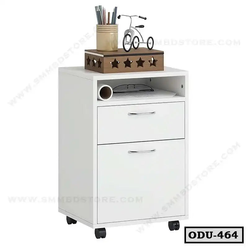 White office drawer unit on wheels with two drawers, open shelf, and decor on top