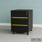 Modern black office drawer unit with three yellow-accented drawers and lockable wheels