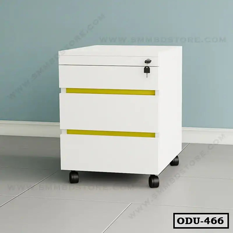 White office drawer unit with three drawers, yellow accents, lock, and wheels, against blue wall