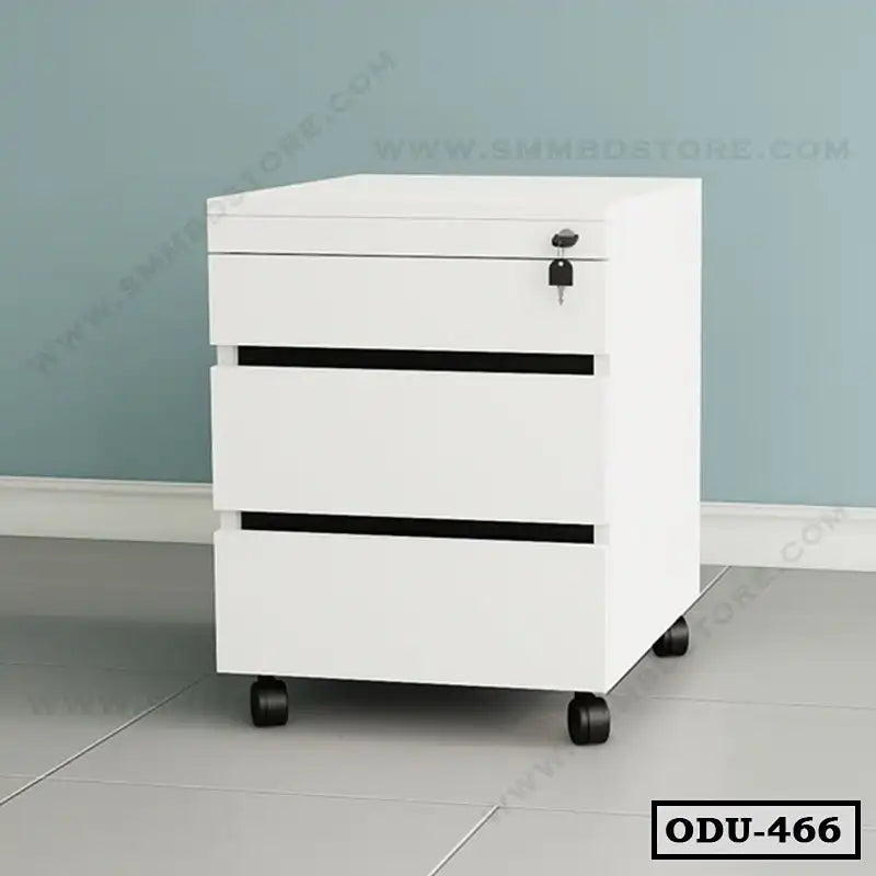 Modern white office drawer unit with three drawers and lock, on wheels, against a blue wall