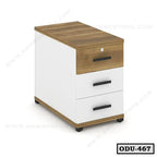 Modern office drawer unit with three drawers, wood top and white body, on small wheels