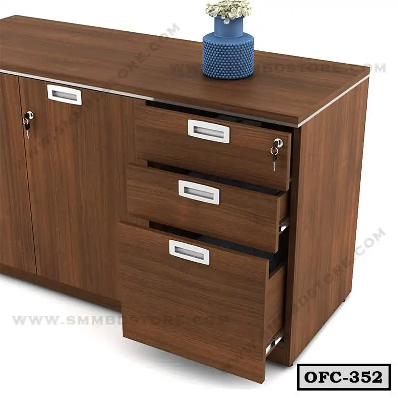Wooden office file cabinet with three open drawers, lockable sections, and a vase on top