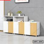Modern white and wood office file cabinet with three doors and open shelves, placed against a gray wall.