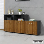 Modern wooden office file cabinet with storage shelves and decorative items against gray wall