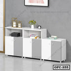Modern white and grey office file cabinet with closed storage and open shelves against a grey wall