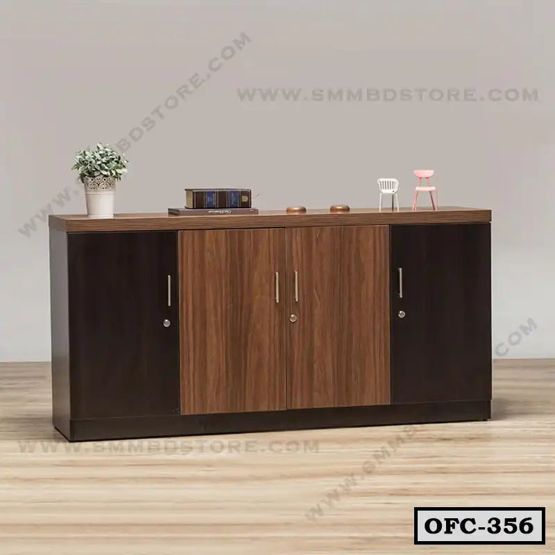 Modern wooden office file cabinet with four doors, decor items, and books on top