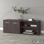 Modern wooden office file cabinet with shelves, decorative vase, and books against gray wall