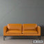 Modern minimalist brown leather office sofa with black metal legs against gray wall