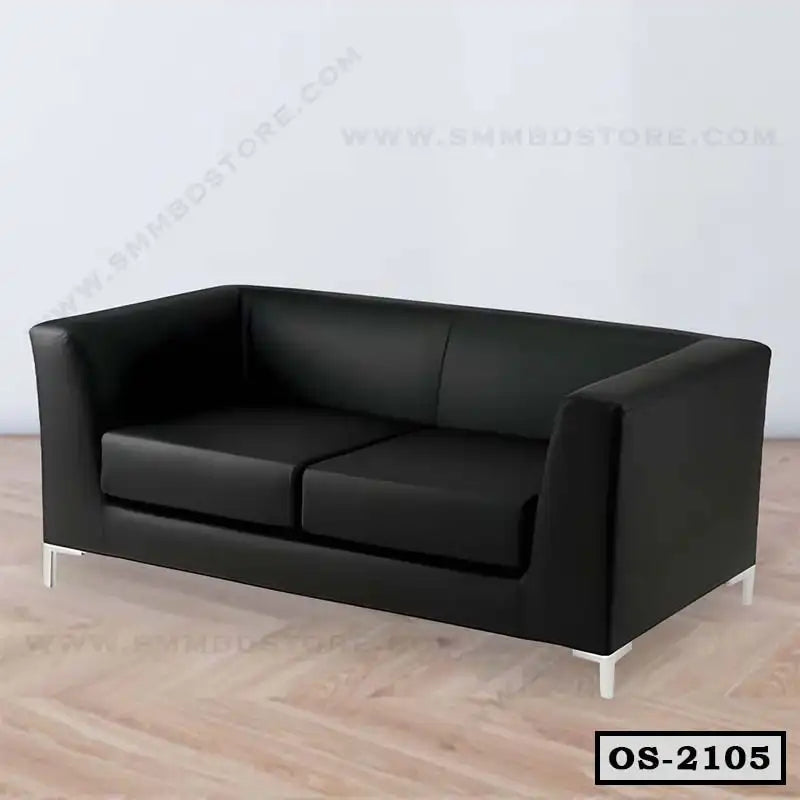 Modern black office sofa with metal legs on wooden floor in minimalist room