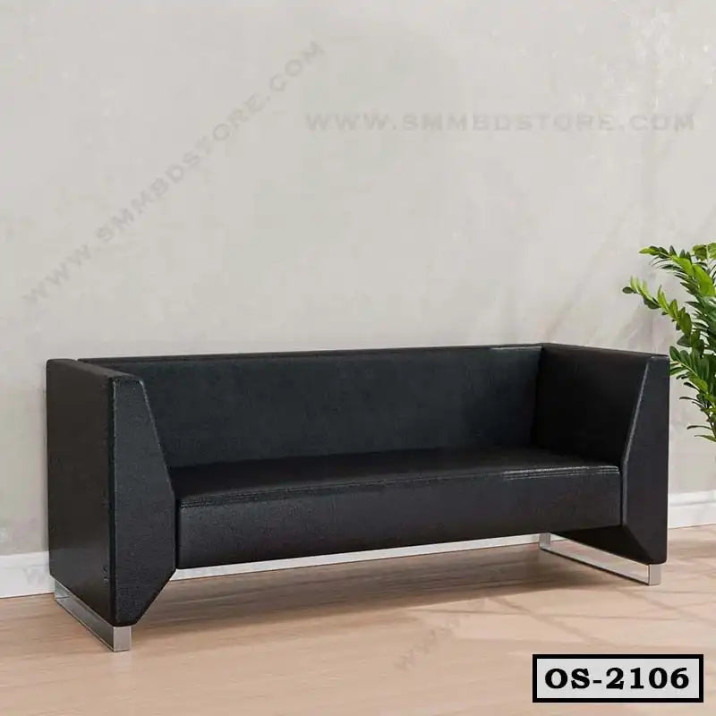 Modern black office sofa with angular armrests and metal legs in a minimalist room Main image