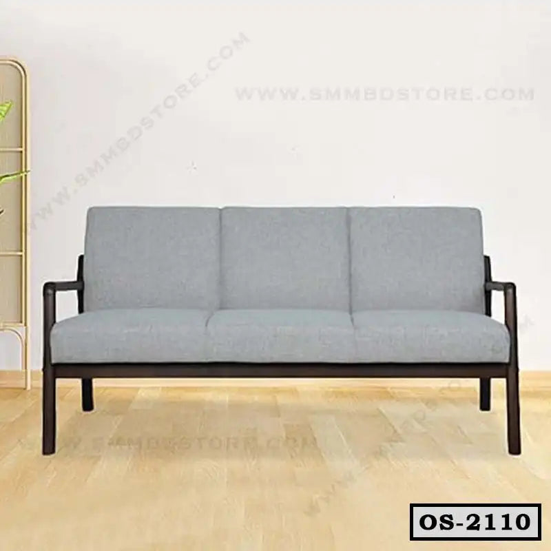 Modern gray office sofa with wooden frame on light wooden floor, three-seat design