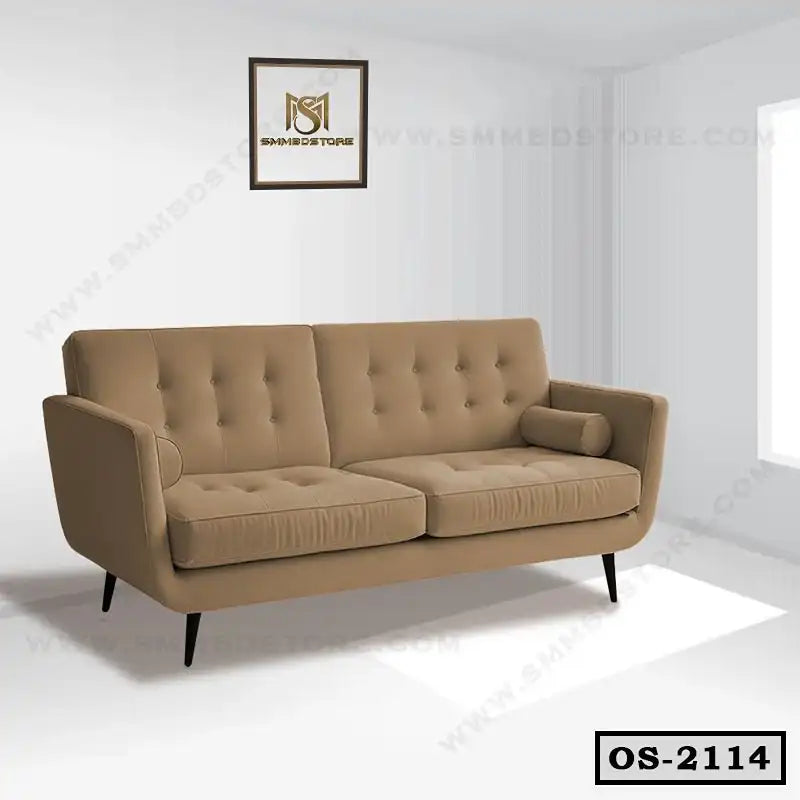 Modern beige office sofa with button tufting and bolster pillows in a bright room
