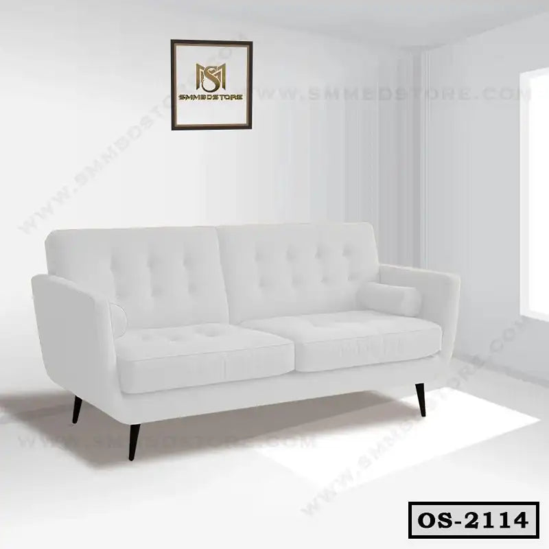 Modern white office sofa with tufted cushions and black legs in a bright room