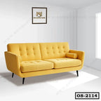 Modern yellow office sofa with tufted cushions and armrest in a bright room