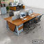 Modern office workstation desk with chairs, computers, drawers, and partition in open workspace