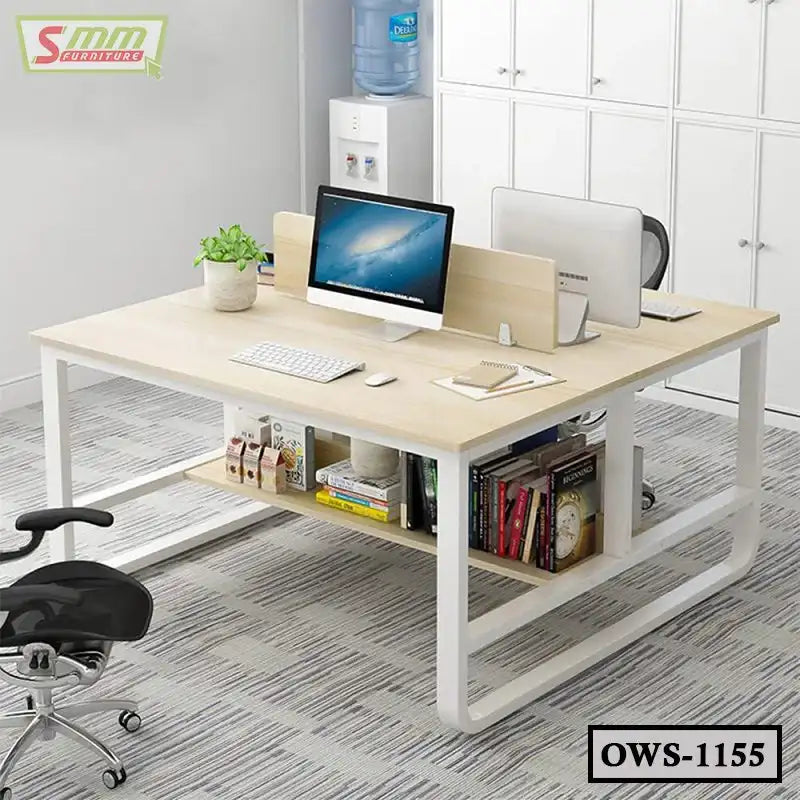 Modern office workstation with light wood desk, storage shelf, computers, and ergonomic chair