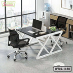 Modern office workstation with two mesh chairs, black desk, computers, and large window view