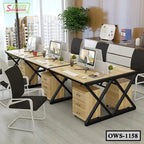 Modern office workstation with black frame, wood desks, chairs, and desktop computers